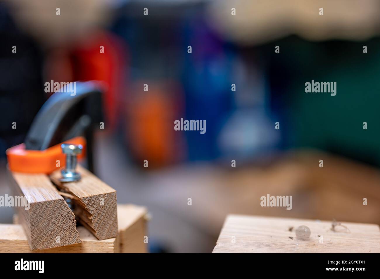 Selective focus on cracked and split wood from not drilling a pilot