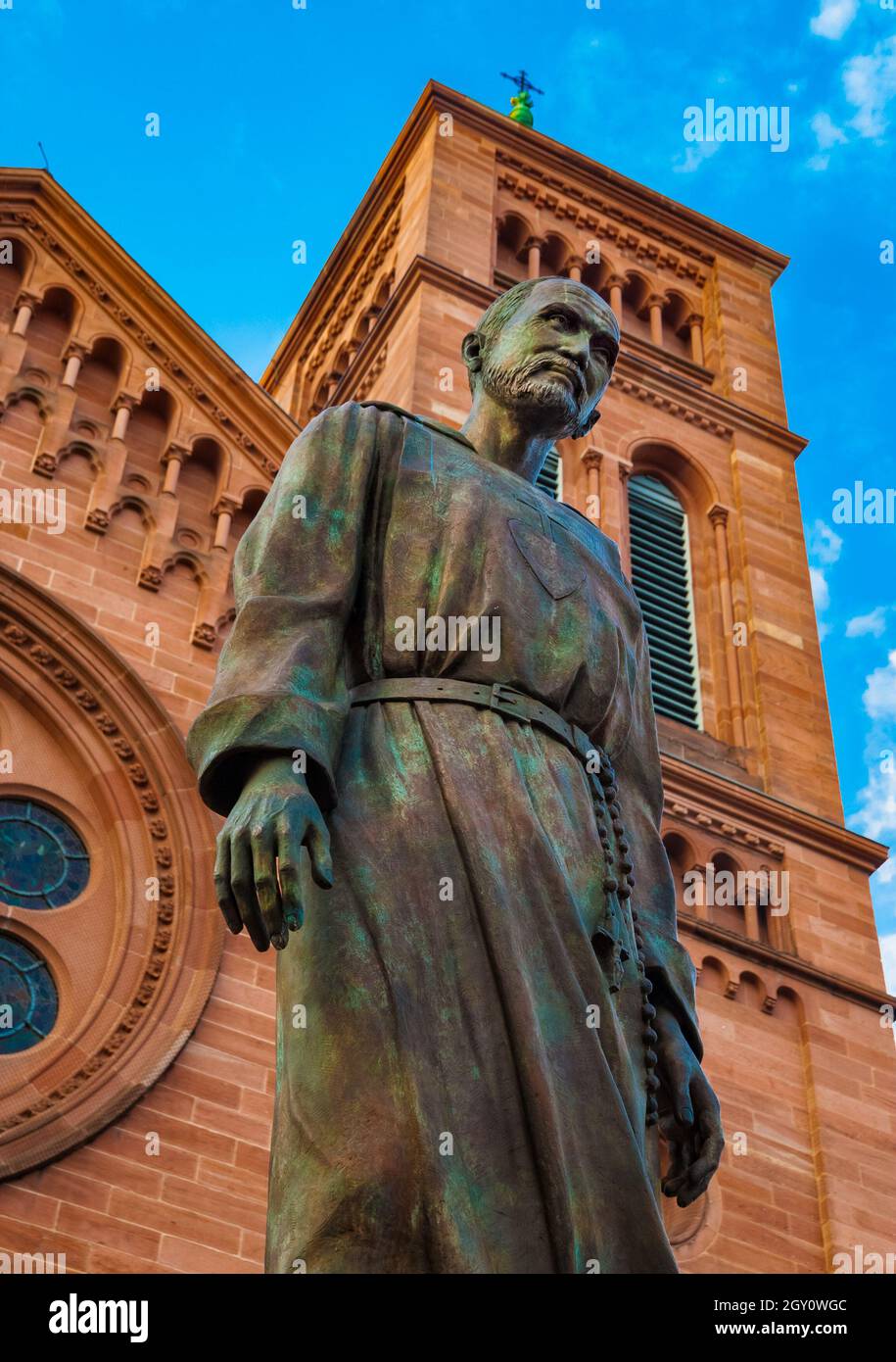 Lovely low angle close-up of the memorial statue of Charles de Foucauld in front of the Saint-Pierre-le-Jeune Catholic Church in Strasbourg. He was... Stock Photo