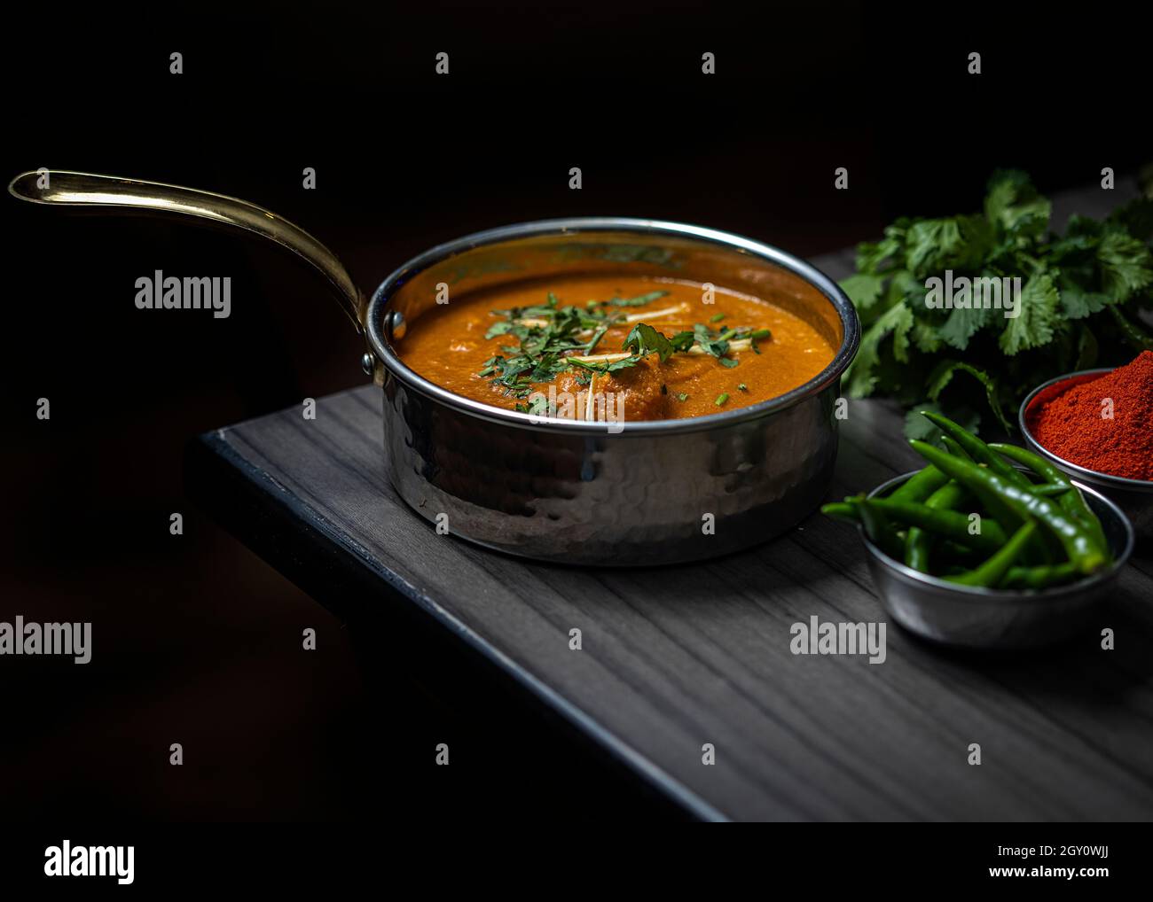 The composition of the Indian dish with spices on the table. Stock Photo