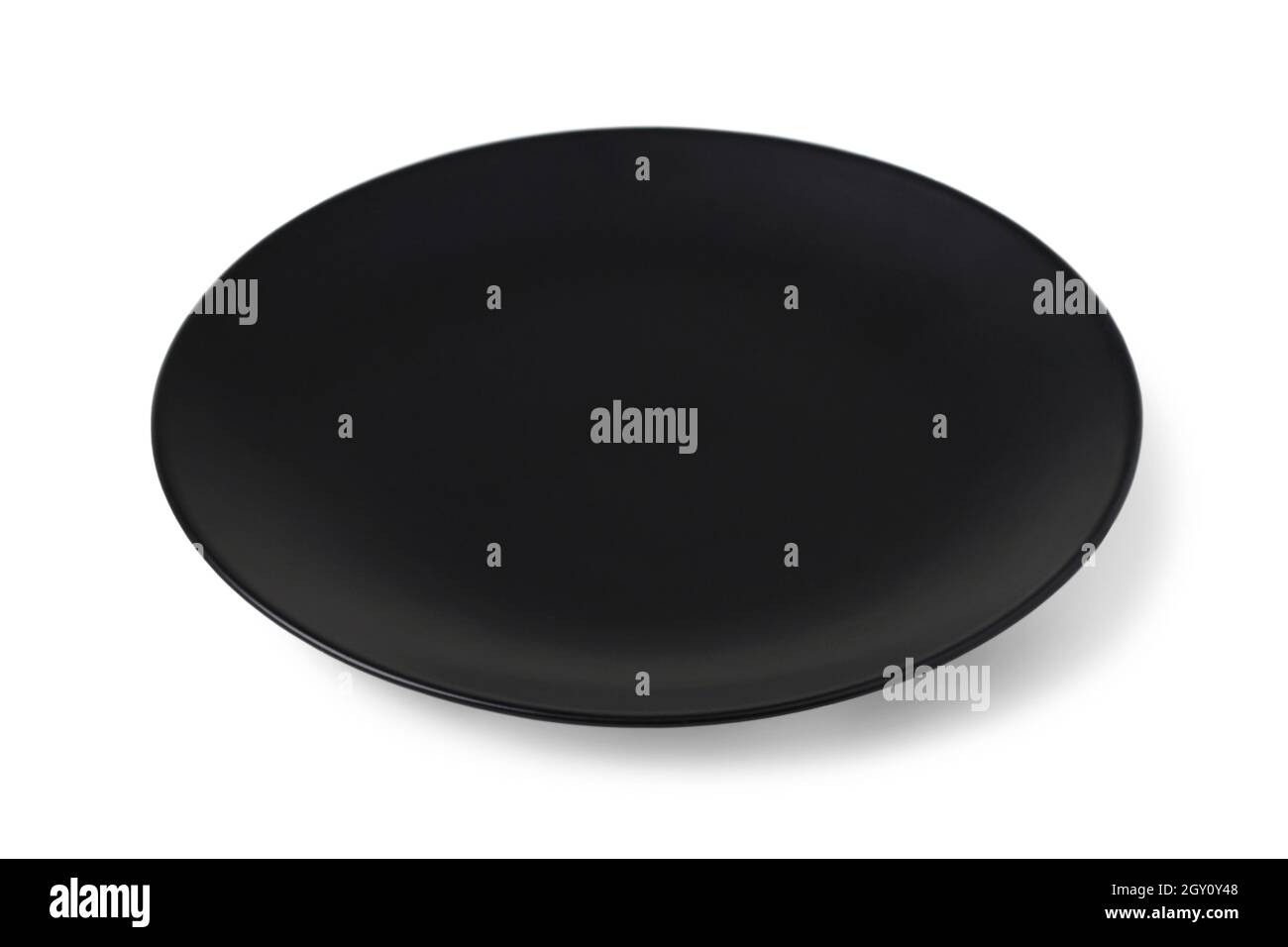 Black ceramic plate isolated on white background Stock Photo