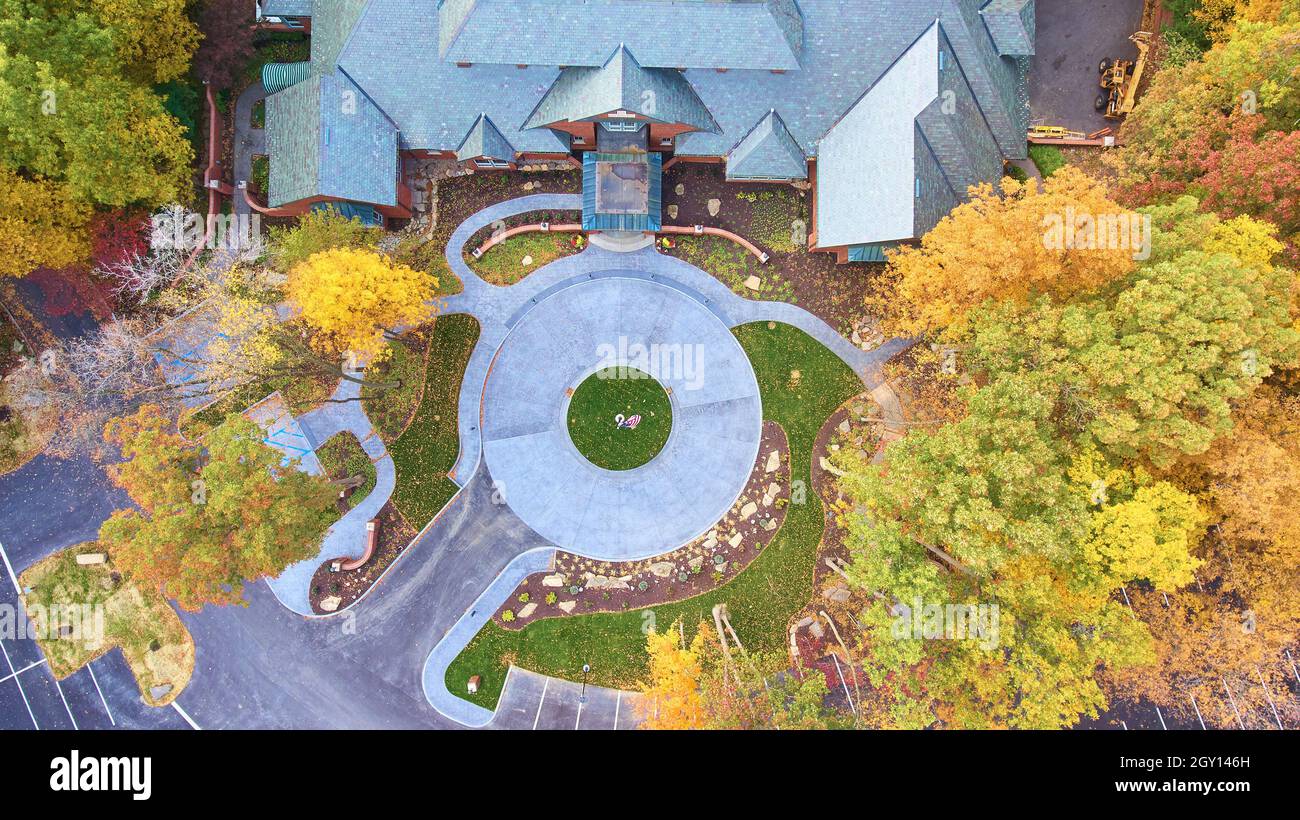 View looking down on mansion with circle driveway surrounded by fall forest  trees Stock Photo - Alamy, image size:1300x820