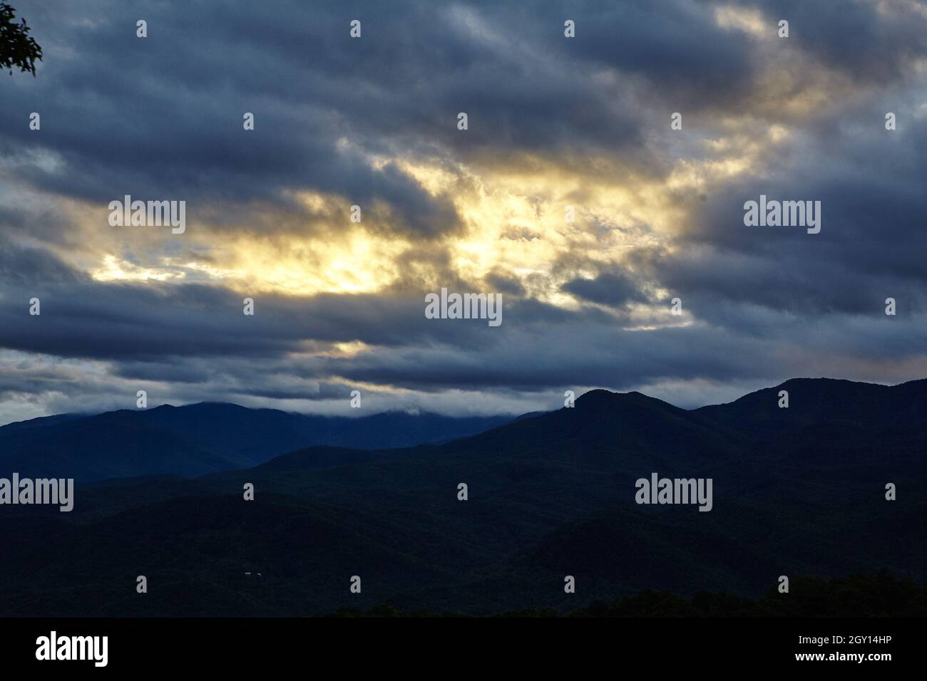 Silhouetted against dark clouds hi-res stock photography and images - Alamy