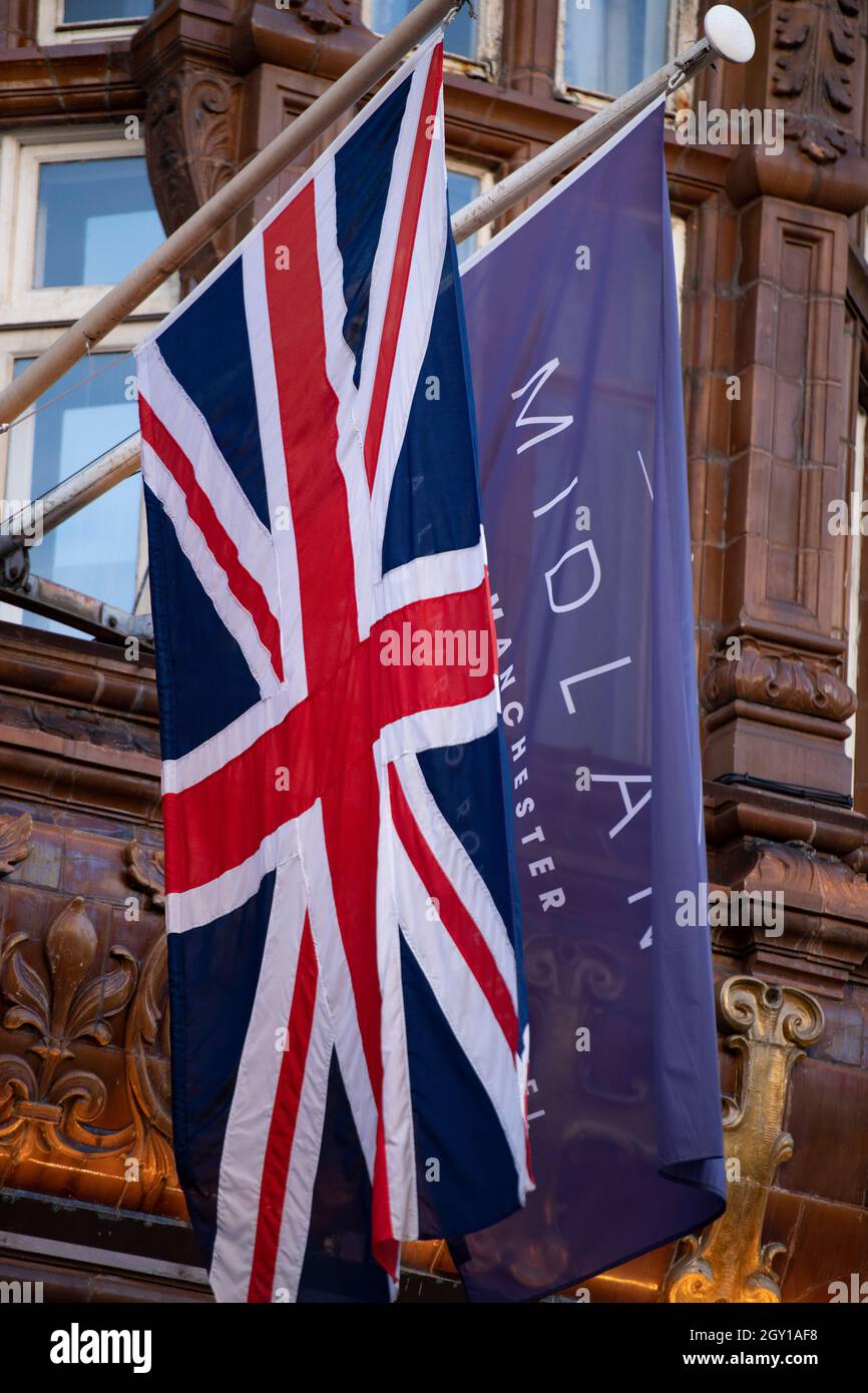 Manchester, England, UK. 6th Oct, 2021. PICTURED: The Union Jack flag hangs down at the front of the Midland Hotel signalling the end of the Conservative party Conference. #CPC21. Credit: Colin Fisher/Alamy Live News Stock Photo