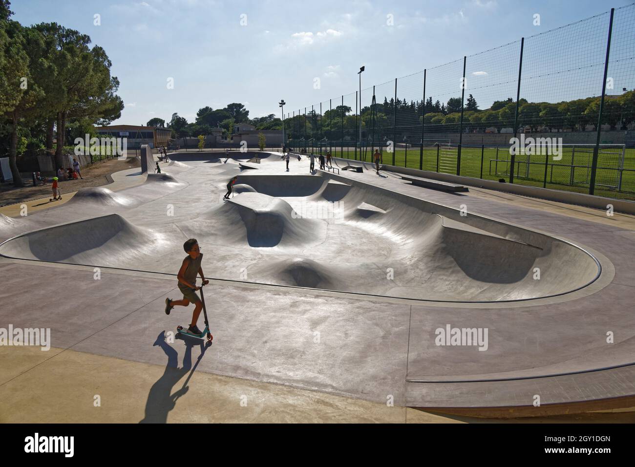 Uzes, France. 17th Jul, 2021. Scooters and skateboards in the Uzes Skatepark. Stock Photo