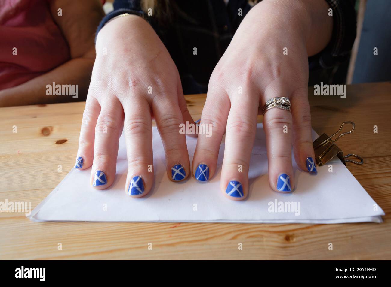 Saltire painted fingernails, Glasgow, Scotland Stock Photo