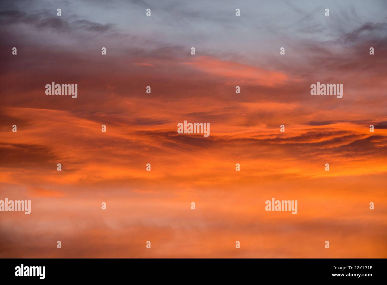 Sunset red sky with clouds horizontal background Stock Photo - Alamy