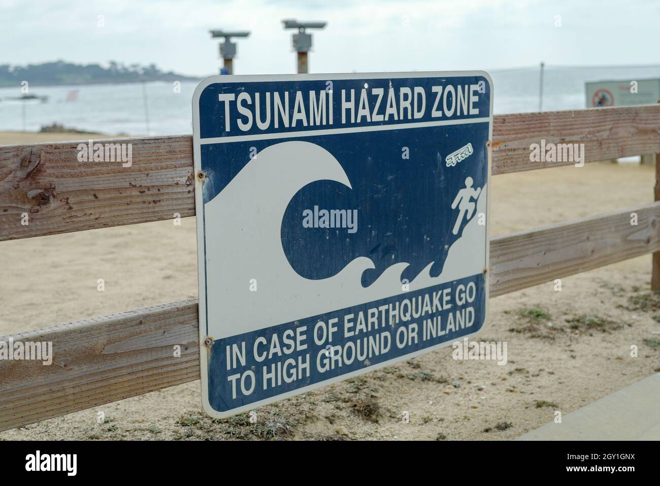 Sign reading Tsunami Hazard Zone and with a graphic of a tsunami wave and evacuation instructions, Pebble Beach, California, September 3, 2021. Photo courtesy Sftm. (Photo by Gado/Sipa USA) Stock Photo