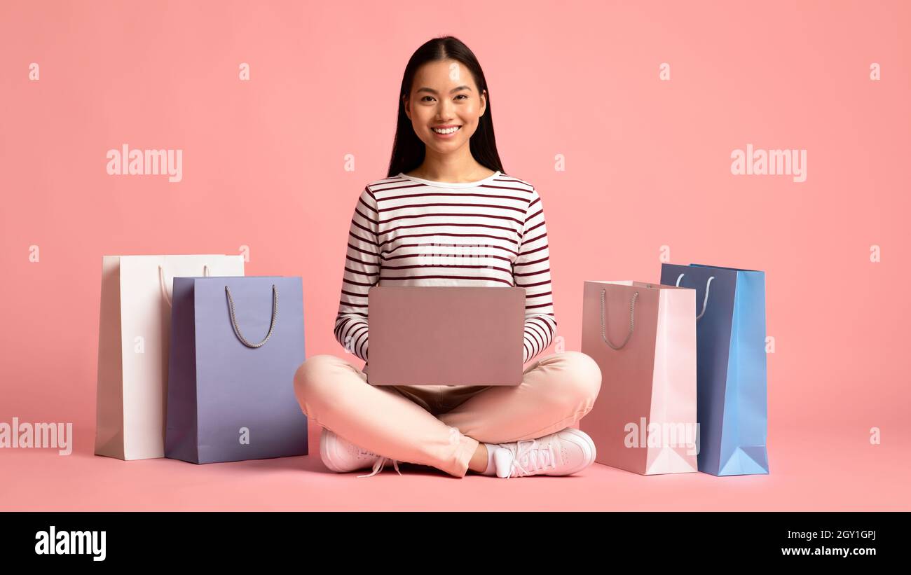 Excited asian lady sitting hi-res stock photography and images - Alamy