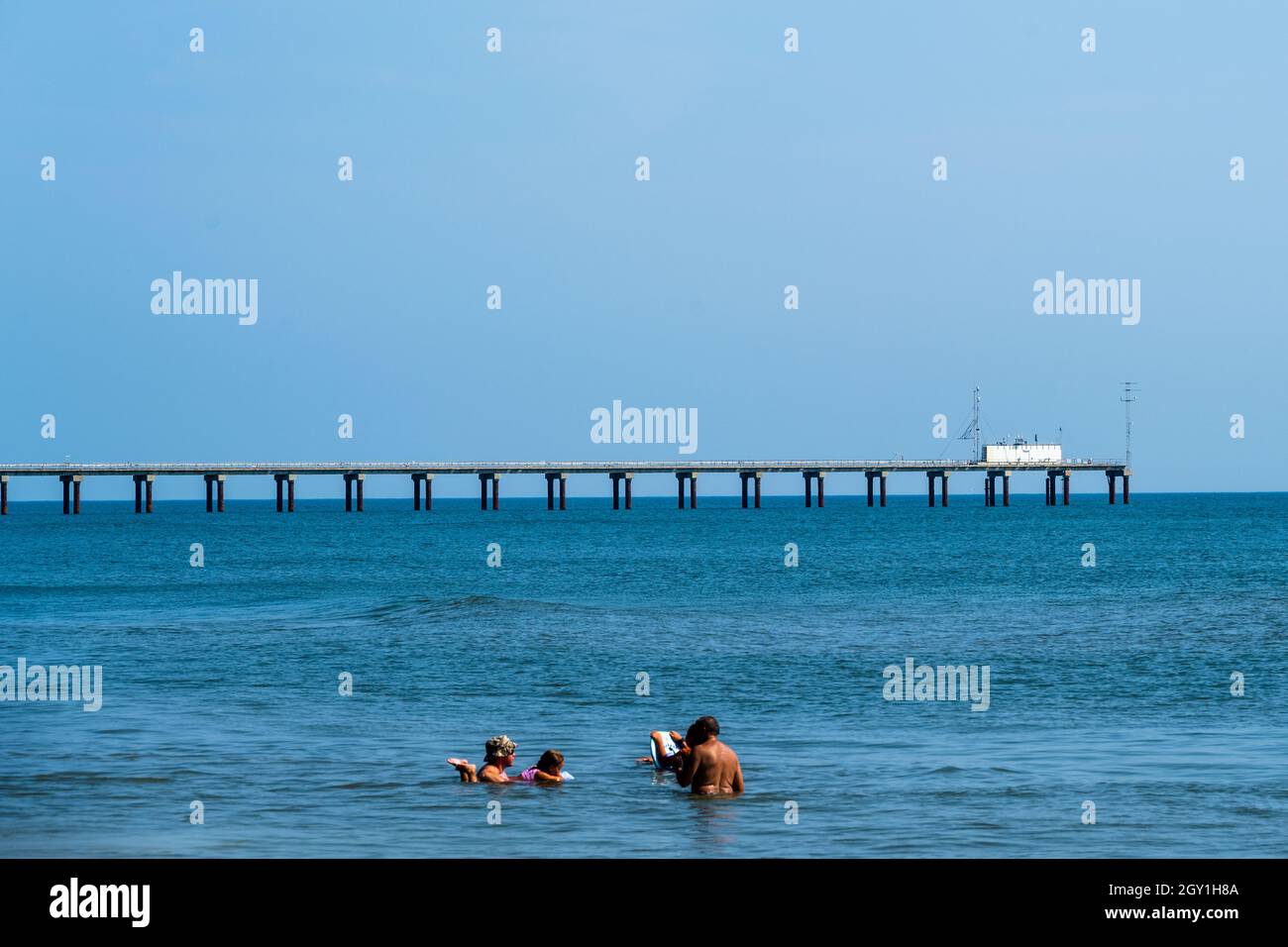 Duck, NC, USA -- Friends take a dip in the Atlantic Ocean on a hot summer day. Stock Photo