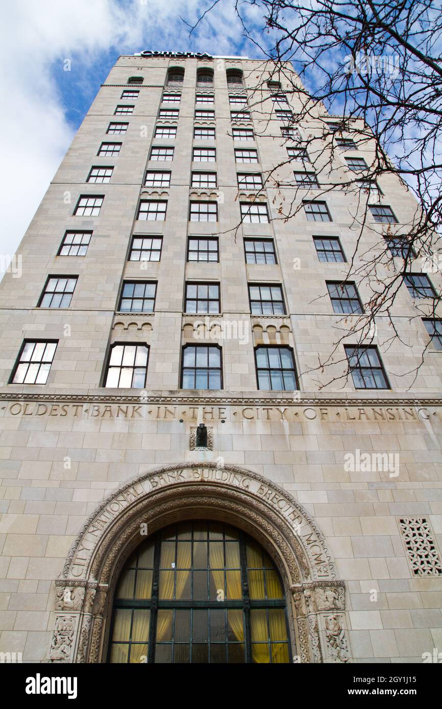 Centered photo of a large white building in Lansing Stock Photo