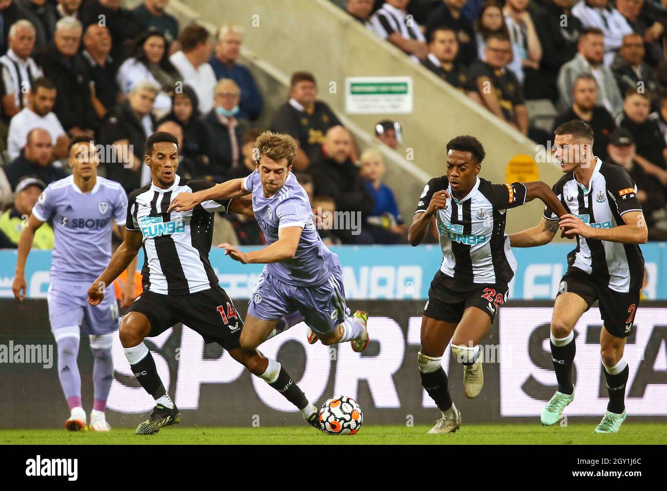 Isaac Hayden of Newcastle United tackles Patrick Bamford of Leeds United - Newcastle United v Leeds United, Premier League, St James' Park, Newcastle upon Tyne, UK - 17th September 2021  Editorial Use Only - DataCo restrictions apply Stock Photo
