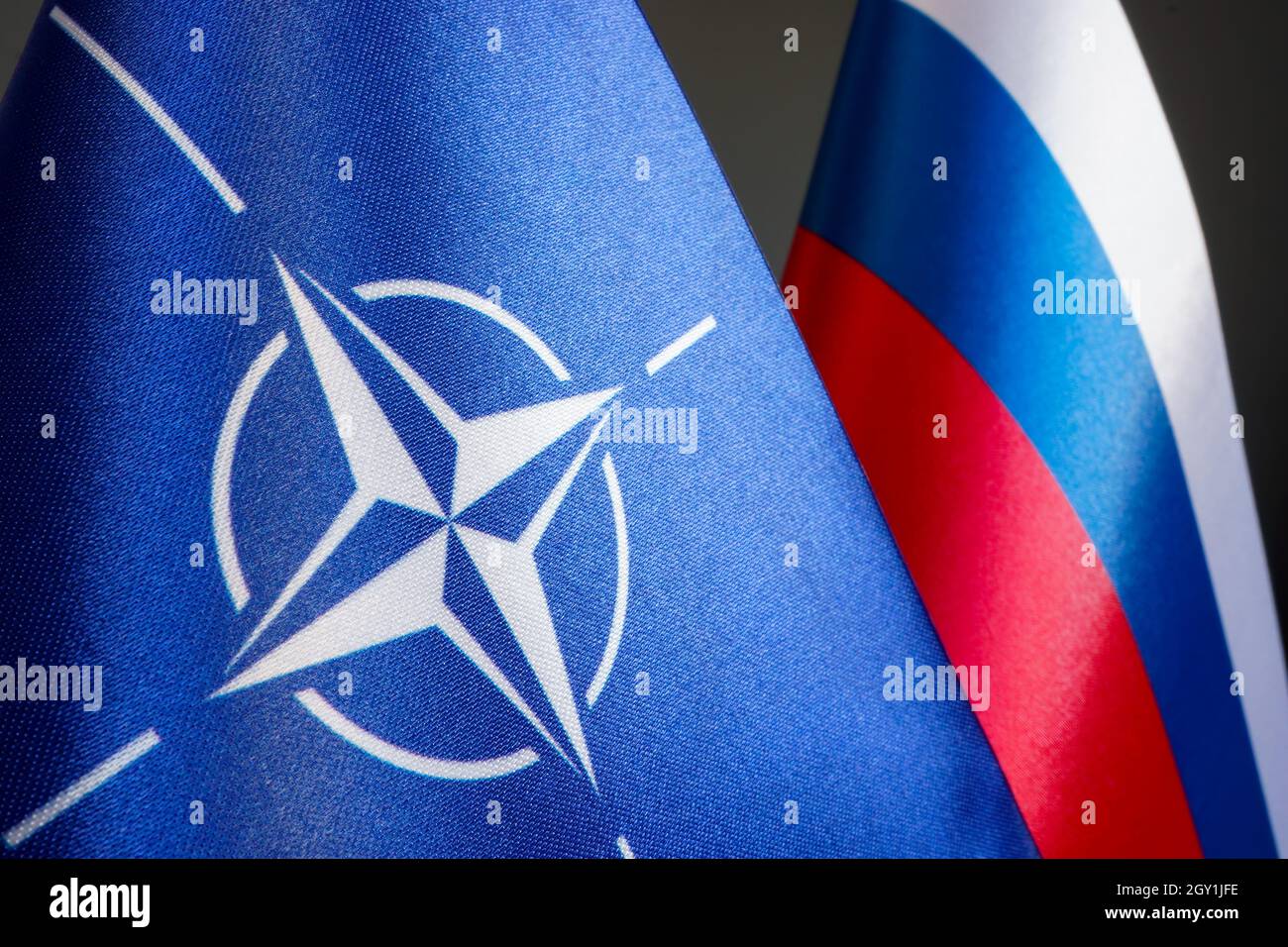KYIV, UKRAINE - October 06, 2021. Flags of NATO and the Russian Federation. Negotiation and conflict. Stock Photo
