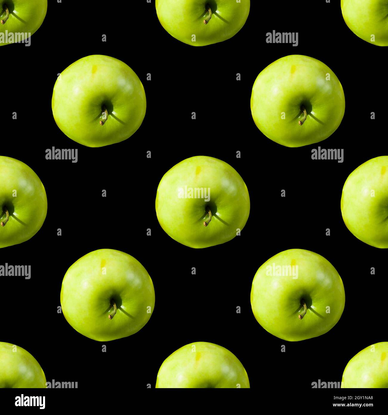 Seamless pattern from green apples on a black background. Photo collage. Stock Photo