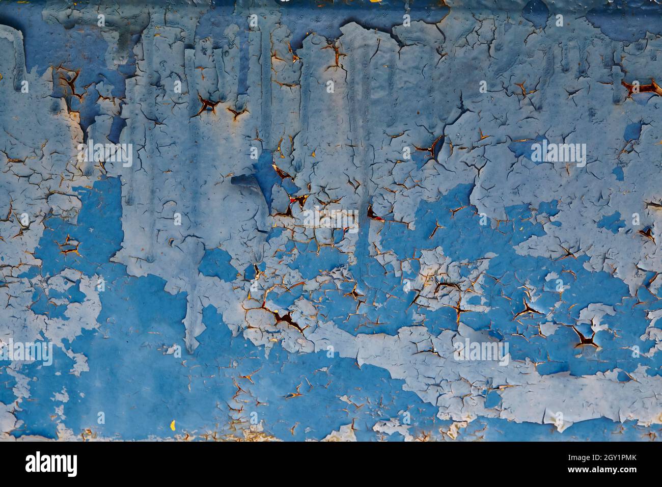 Abandoned blue wall with light blue and dark blue peeling paint ...