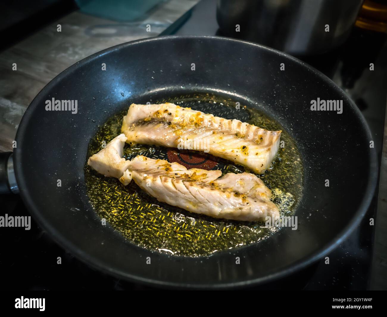 Fried fish in a pan, top view, omega 3 vitamins Stock Photo Alamy