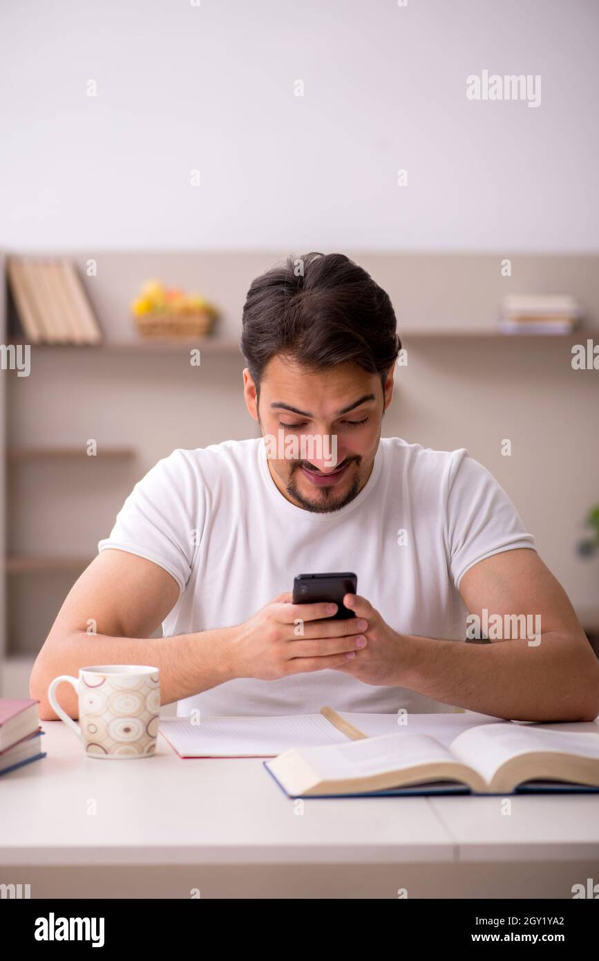 Young student studying at home during pandemic Stock Photo - Alamy