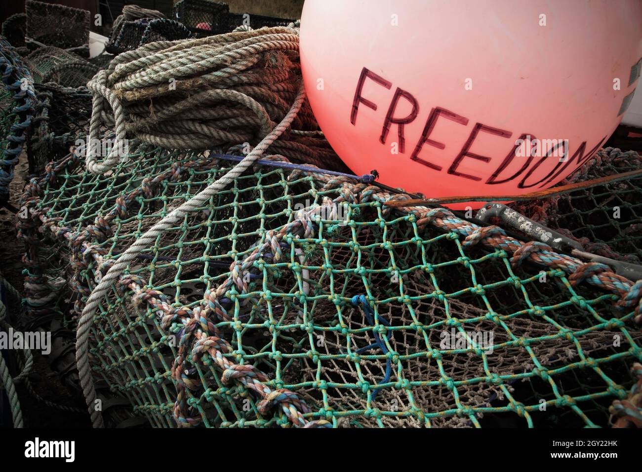 Lobster pots and fishing net buoy marked Freedom Stock Photo - Alamy