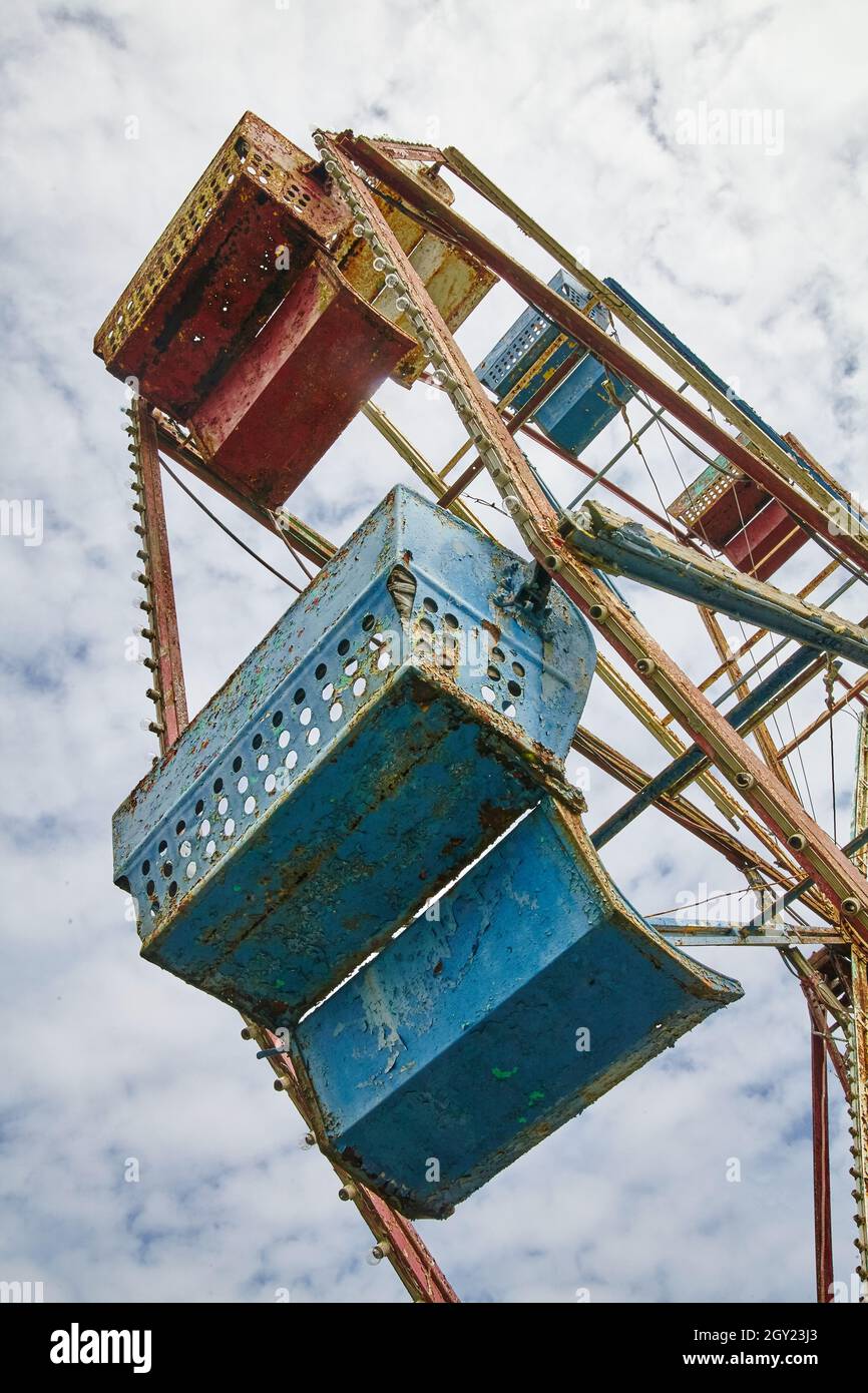 Worm's eye view of an abandoned ferris wheel at an old theme park Stock Photo