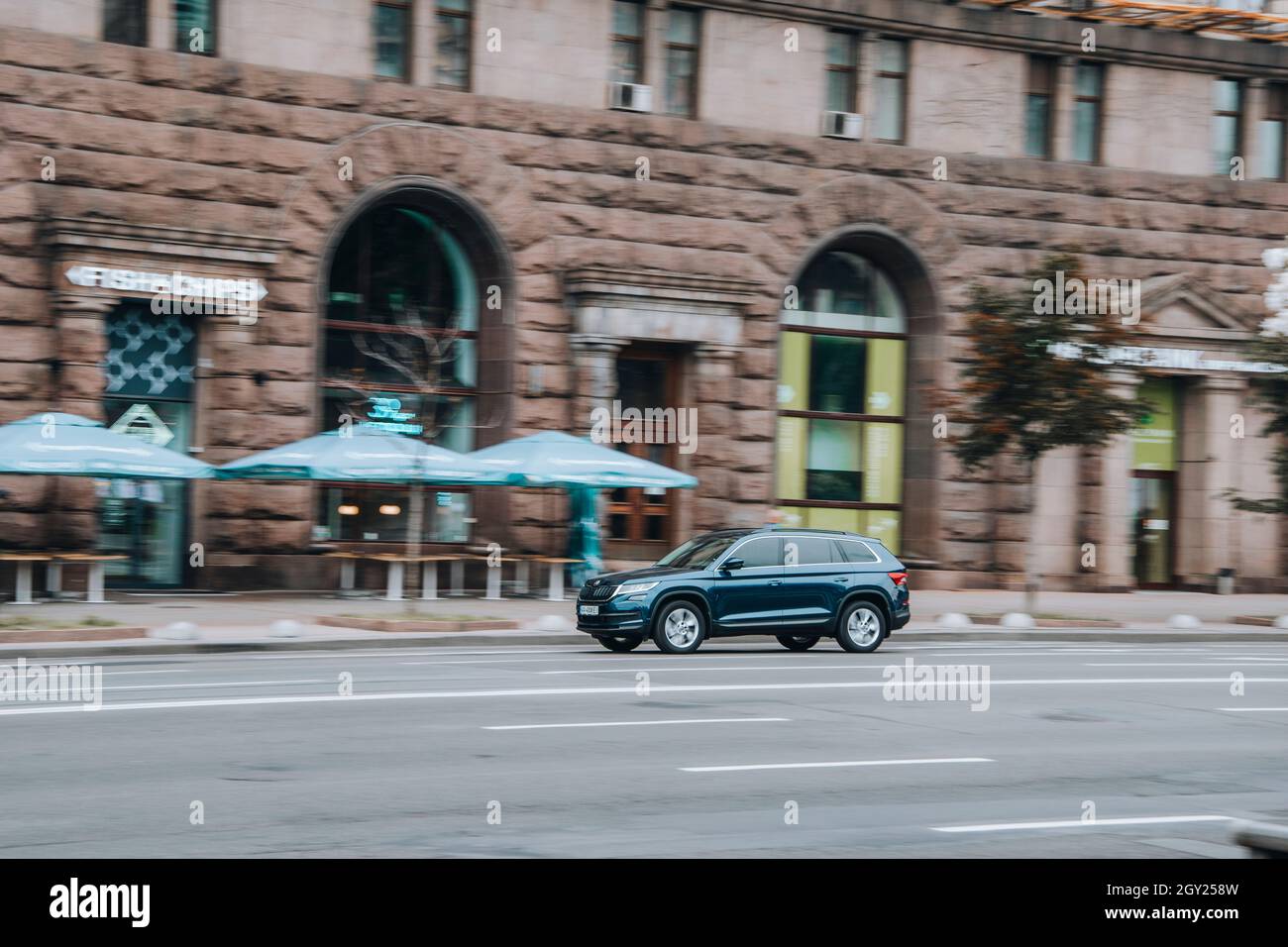 Ukraine, Kyiv - 2 June 2021: Blue Skoda Kodiaq car moving on the street. Editorial Stock Photo