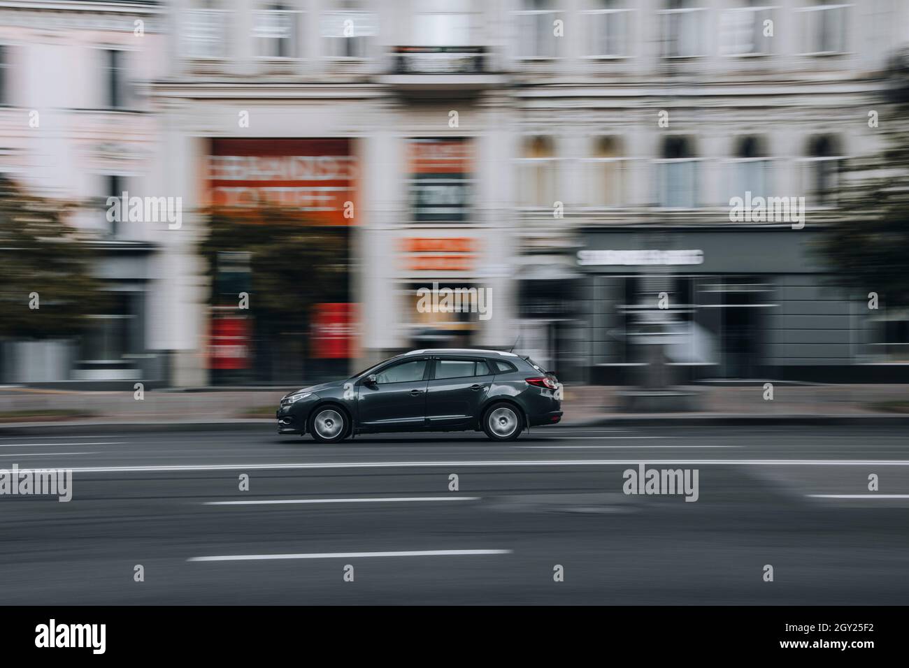 Ukraine, Kyiv - 2 June 2021: Gray Renault Sandero car moving on the street. Editorial Stock Photo