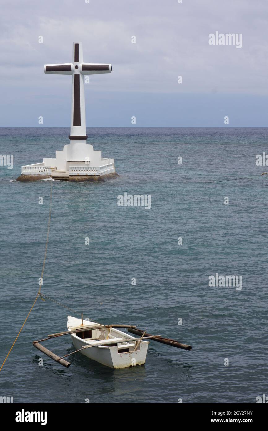 CATARMAN, PHILIPPINES - Aug 16, 2015: A big cross on the Sunken Cemetery, town of Catarman, Camiguin island province, Philippines Stock Photo
