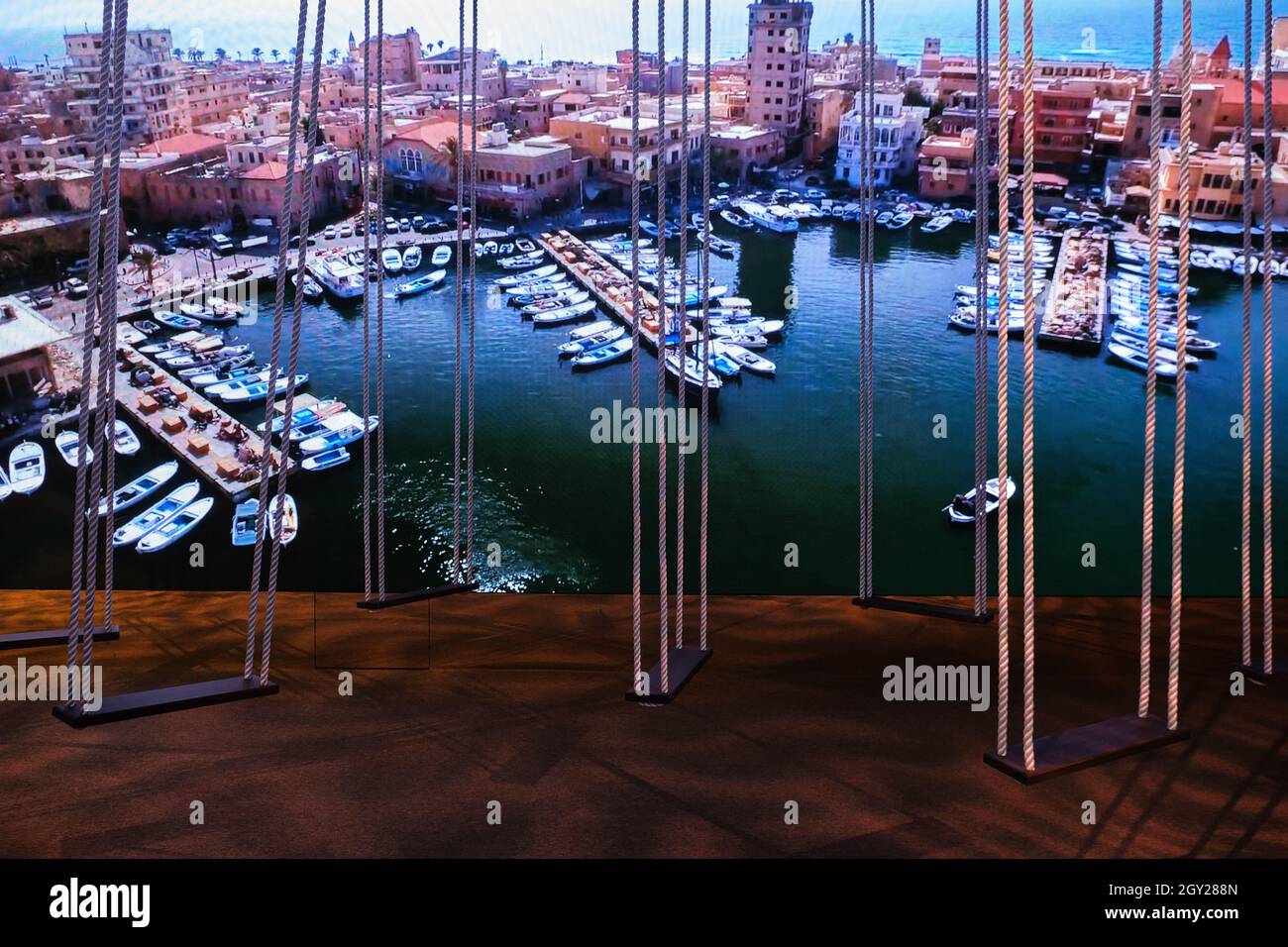 Wooden rope swings exhibition inside the Lebanon Pavilion in the