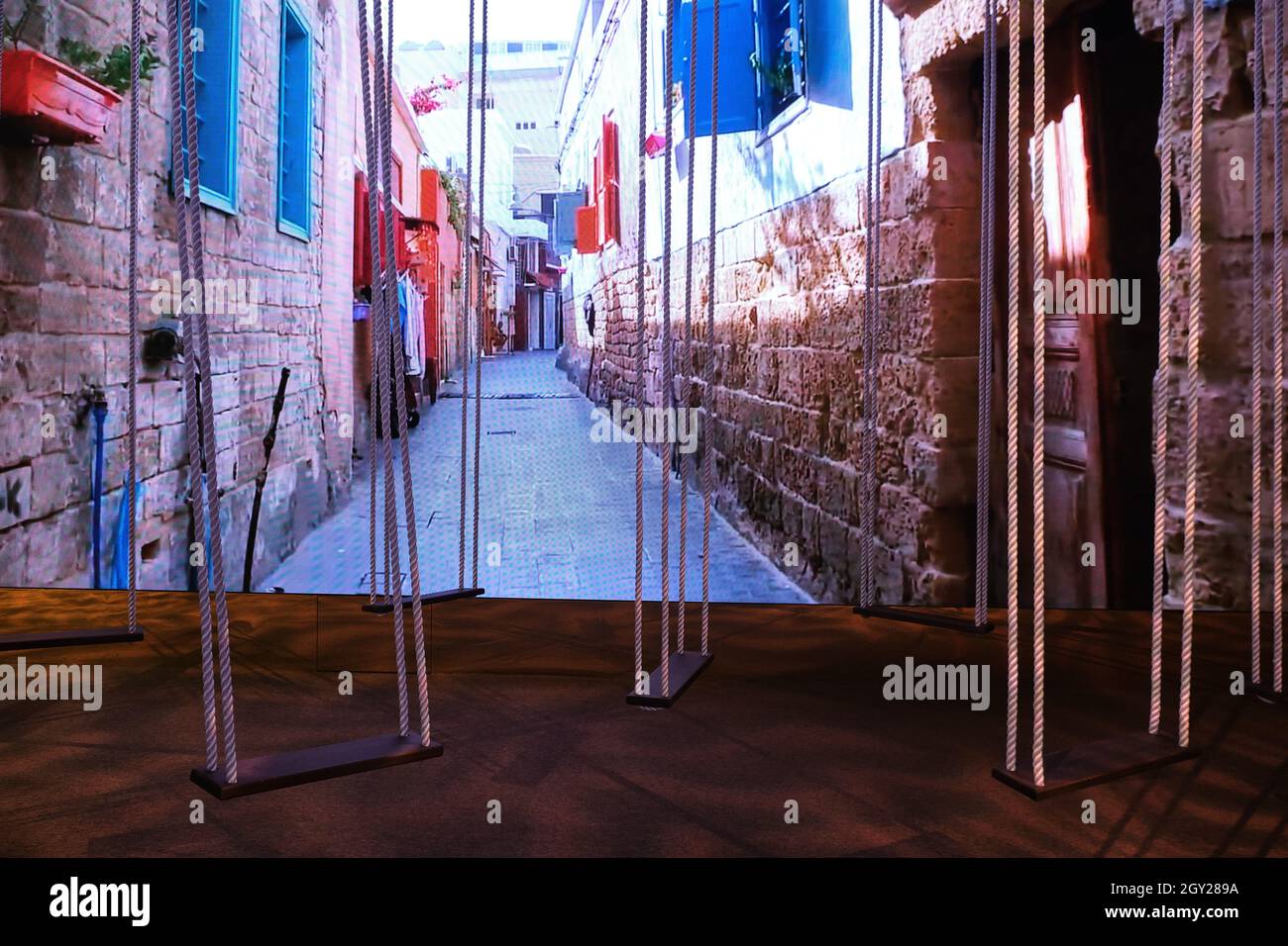 Wooden rope swings exhibition inside the Lebanon Pavilion in the