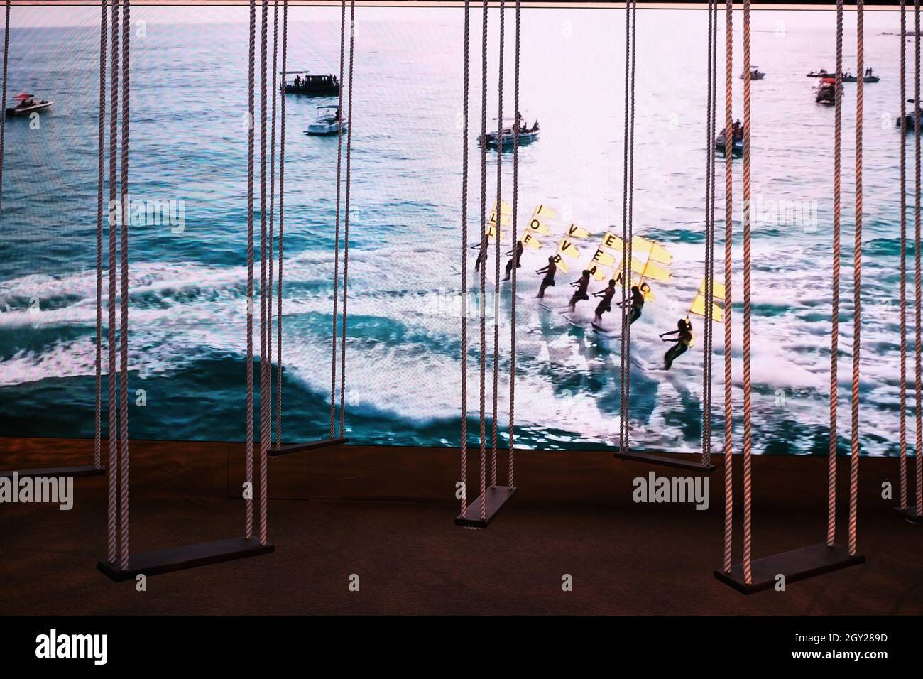 Wooden rope swings exhibition inside the Lebanon Pavilion in the