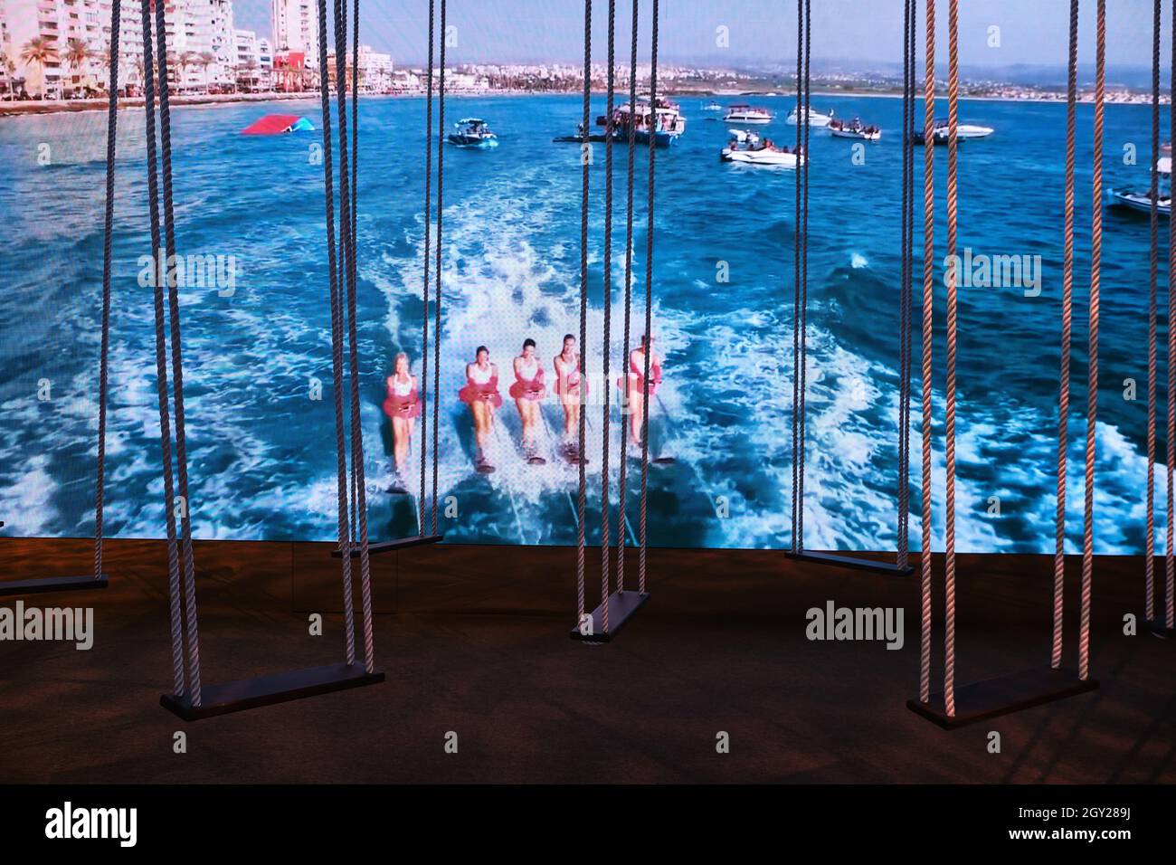 Wooden rope swings exhibition inside the Lebanon Pavilion in the