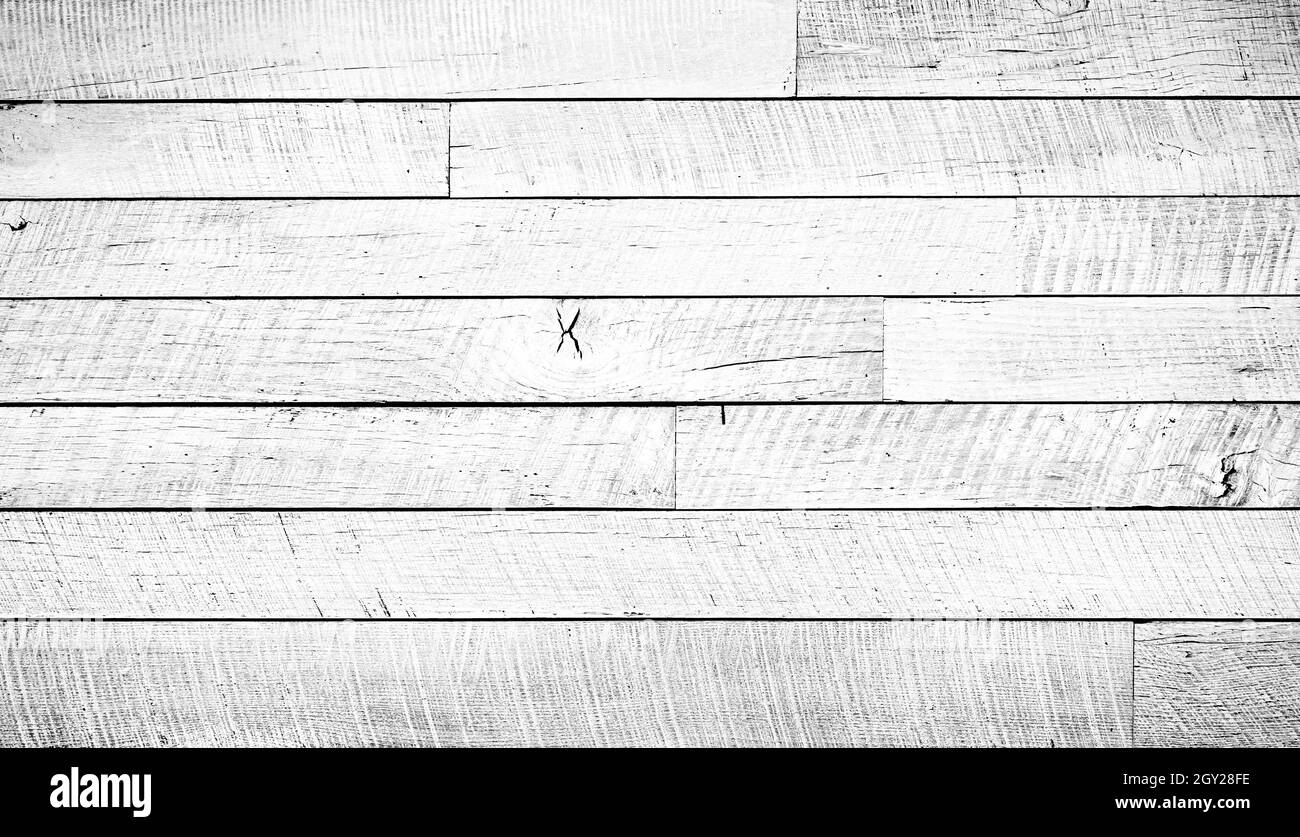 Crackled paint finish on white wood planks. Aged reclaimed barn wood