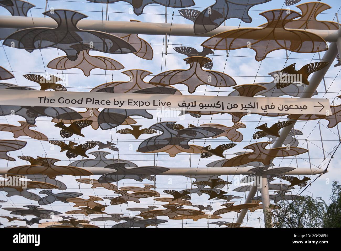 Dove inspired covered walkway with directions to the Good Place
