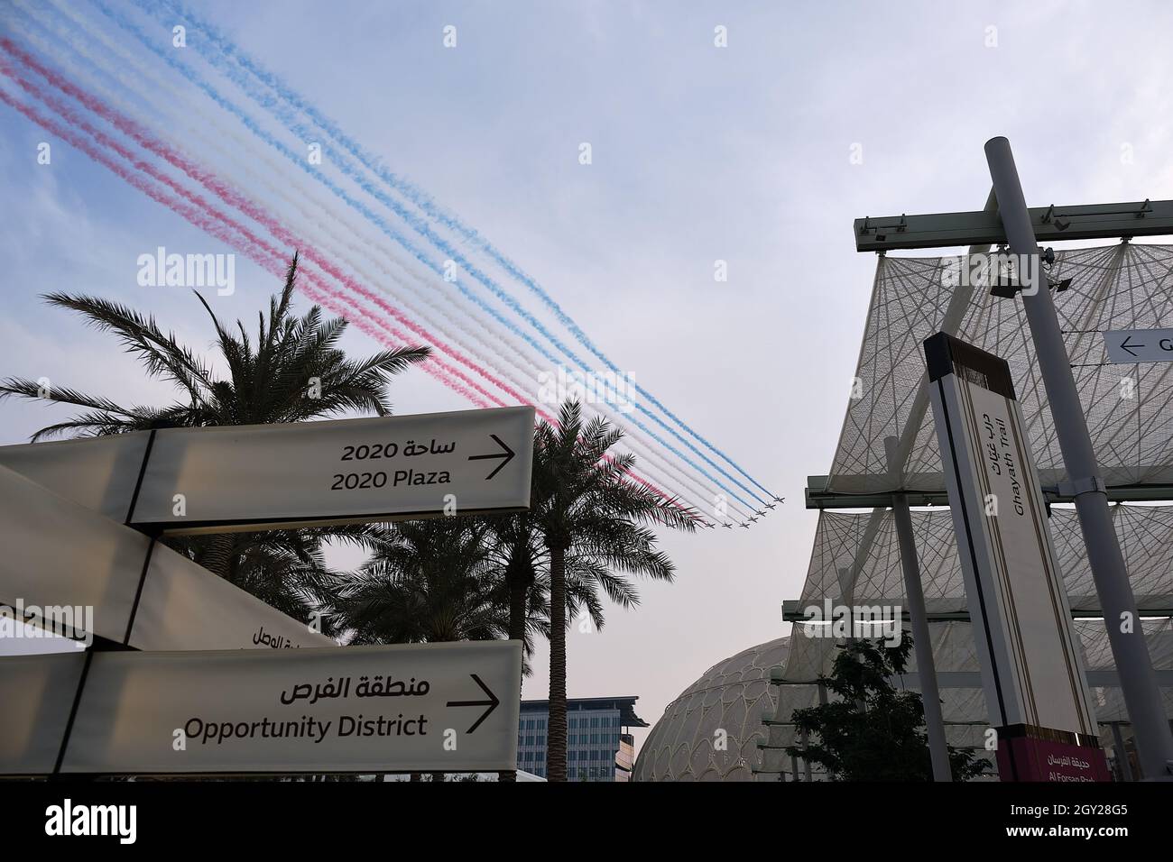 The Patrouille de France airshow with planes flying the French national colours over the Dubai Expo 2020 site, Dubai, UAE Stock Photo