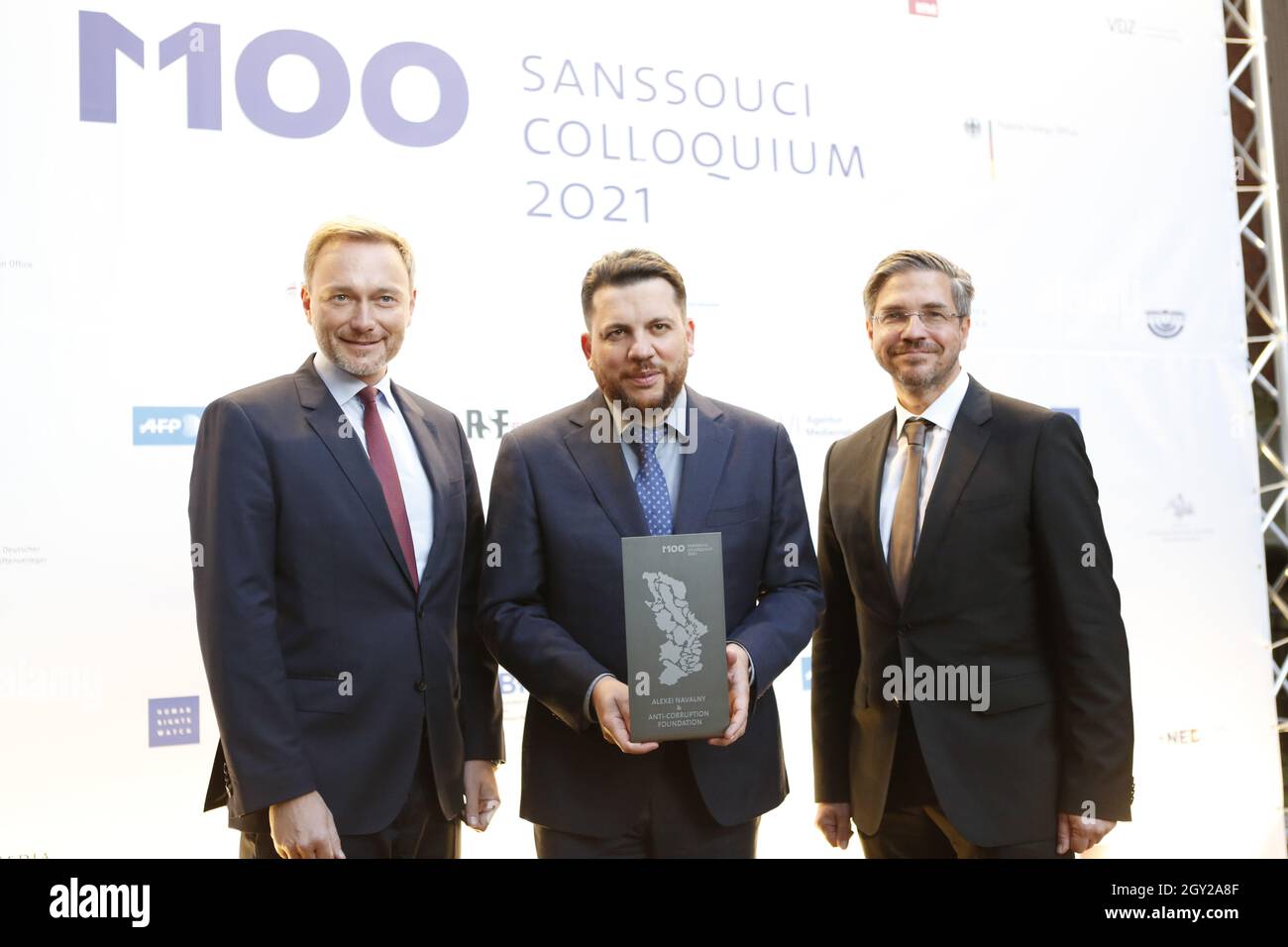 10/06/2021, Potsdam, Germany. Christian Lindner, laudator and federal chairman of the FDP,Leonid Volkov and  Potsdam's Lord Mayor Mike Schubert. M100 Media Award: Imprisoned Kremlin critic Navalny receives media award in Potsdam. The award for Navalny, who has been imprisoned since January, is accepted by his closest colleague and confidante Leonid Volkov. Stock Photo