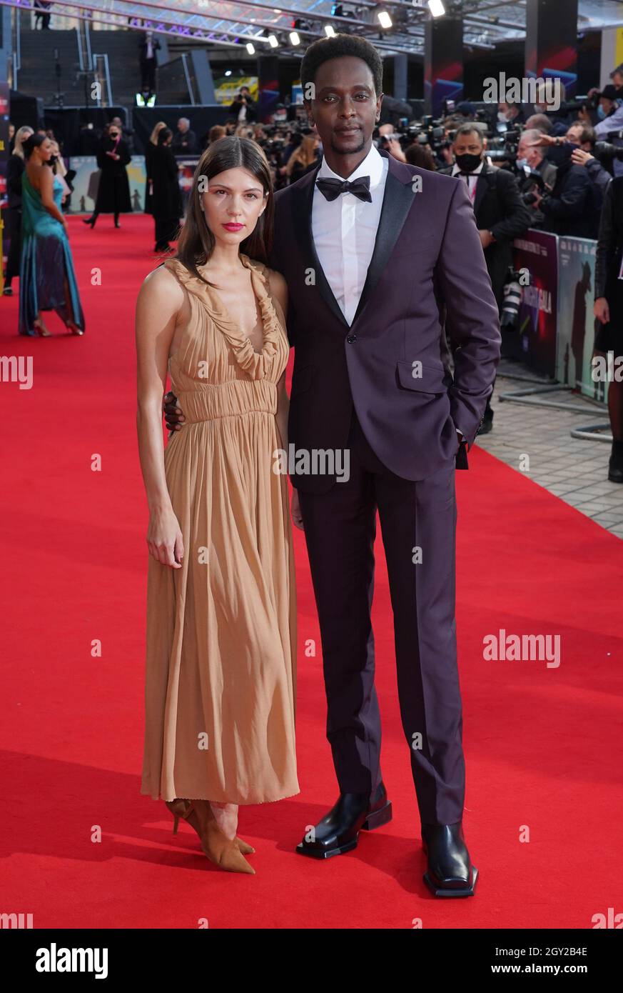 Adriana Marinescu and Edi Gathegi arrive for The Harder They Fall world premiere at the Royal Festival Hall in London during the BFI London Film Festival. Picture date: Wednesday October 6, 2021. Stock Photo