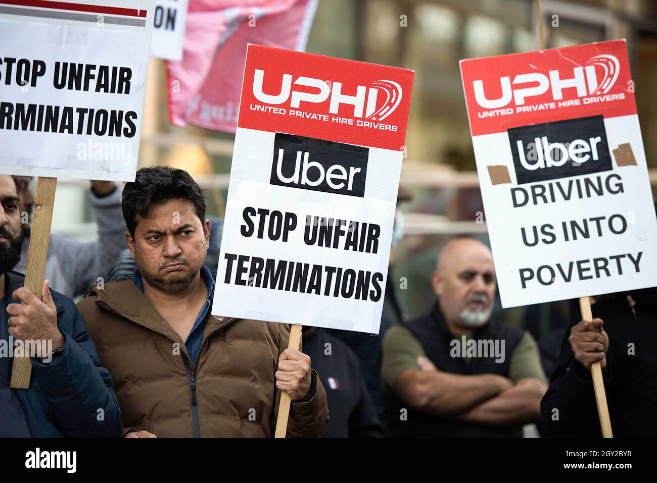 London, UK. 06th Oct, 2021. Uber drivers strike holding placards at Uber's headquarters, during the demonstration. Uber drivers held a strike in London during a 24-hour action to demand better rate per mile, 15% max commission, transparency of charges on customers, no fixed rate trips, 50% surcharge on out of area trips, no more unfair deactivations, and reinstatement of unfairly deactivated drivers. Credit: SOPA Images Limited/Alamy Live News Stock Photo