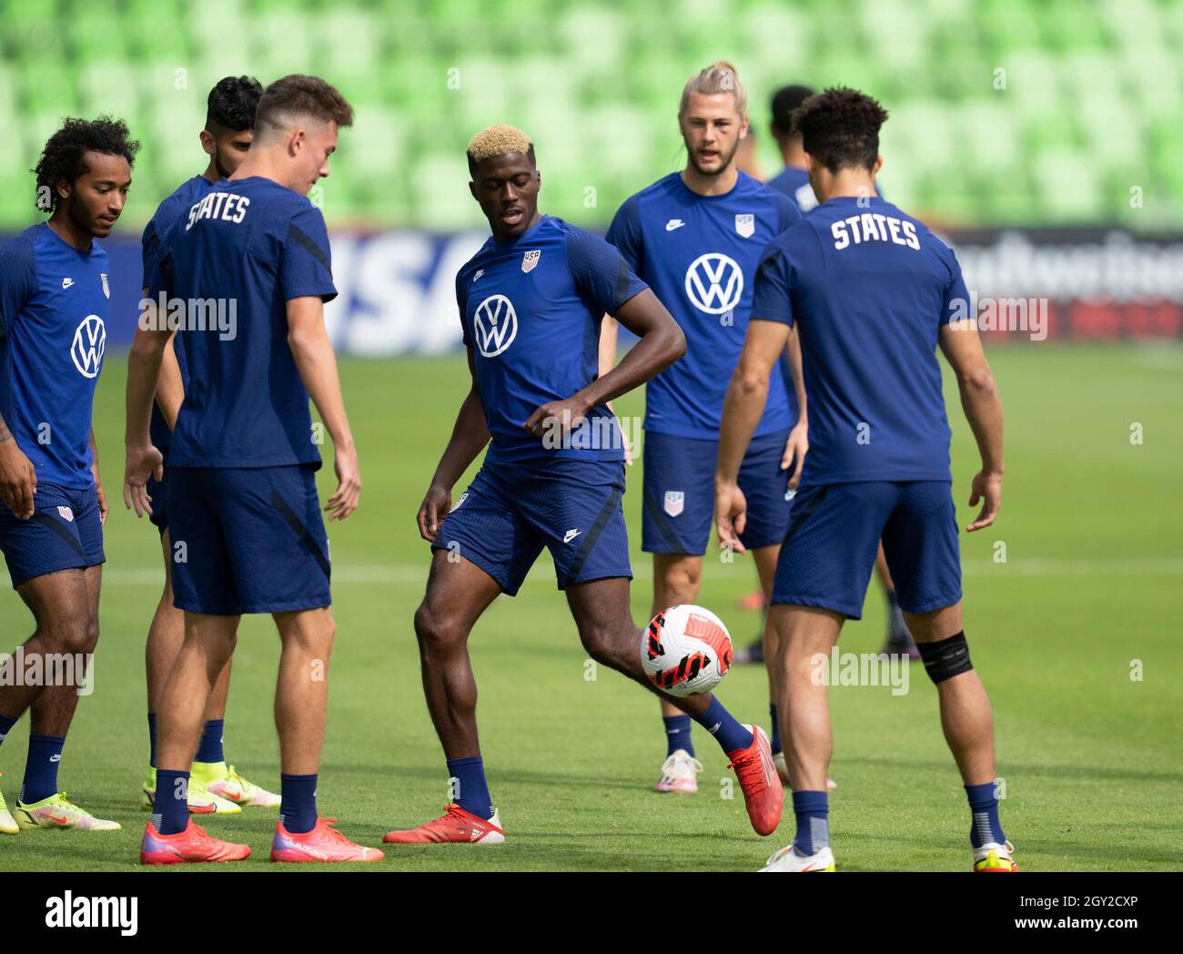 Austin, Texas, USA. 6th October, 2021. Forward GYASI ZARDES kicks the ball as members of the United States Men's National Team (USMNT) warm up for practice at Austin's Q2 stadium on Wednesday, October 6, 2021. The U.S. team will face Jamaica on Thursday in a World Cup qualifying match. Credit: Bob Daemmrich/Alamy Live News Stock Photo