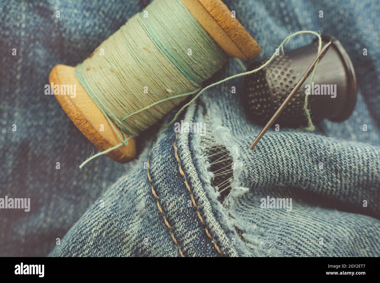 Needles and Thread on the Background of Torn Jeans the Concept of  Reasonable Consumption of Needlework for Small Stock Image - Image of  sustainability, sewing: 263221625