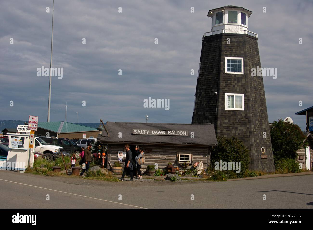 Traditional lighthouse and pub Salty Dawg Salon in the Homer Spit, Homer, Alaska, USA Stock Photo