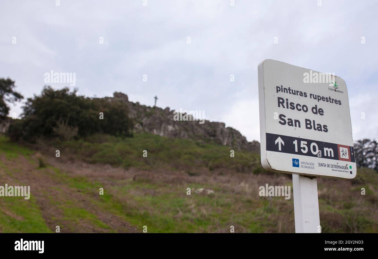 San Blas rock shelter information pole pointing to prehistorical paintings. Alburquerque, Badajoz, Extremadura, Stock Photo
