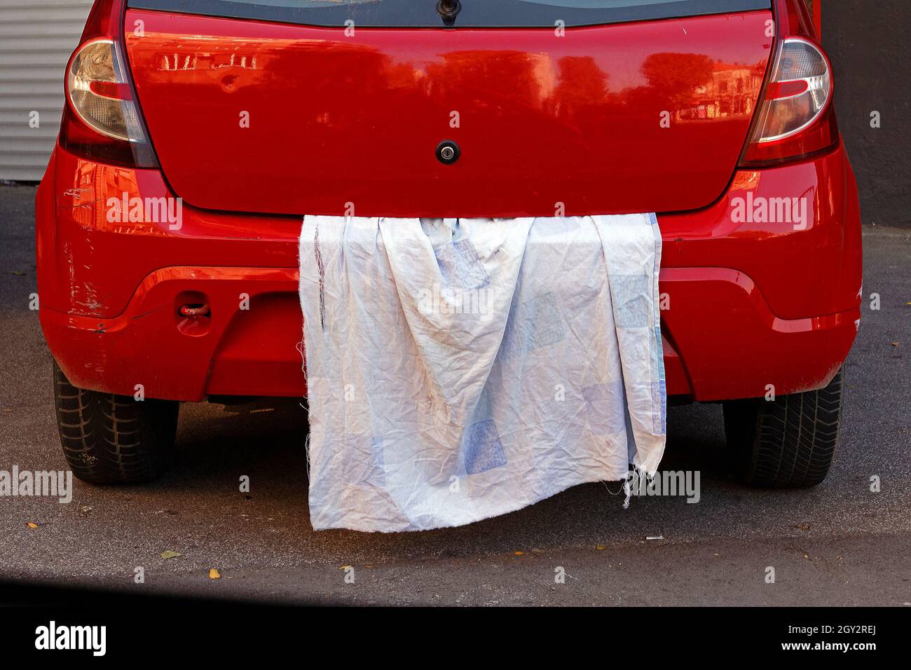 Car license plate hidden with white cloth on a street Stock Photo Alamy