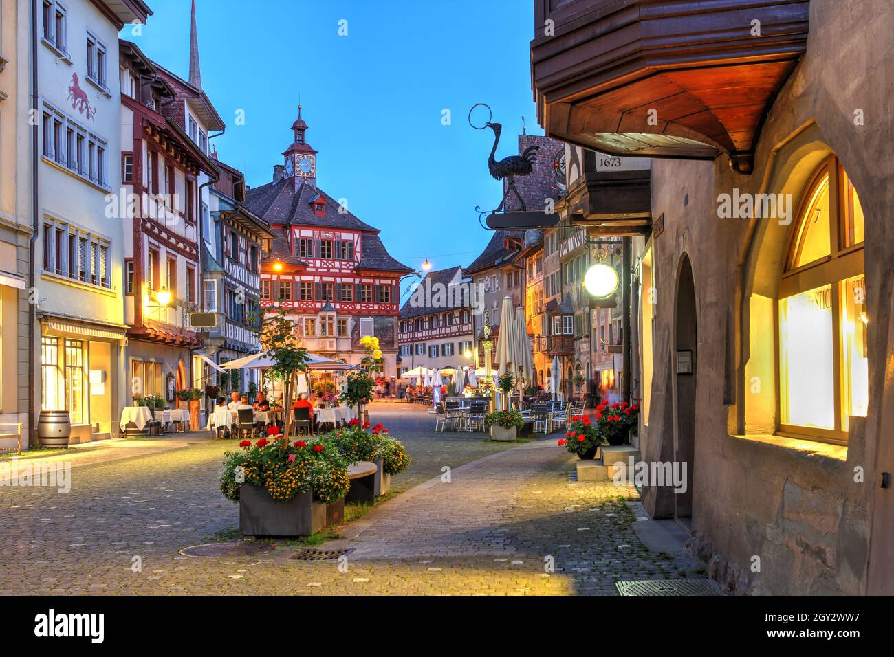 Summer evening in Stein am Rhein along the Rathausplatz, with the Town Hall at the far end. Stein am Rhein is a historic town west of Lake Constance ( Stock Photo