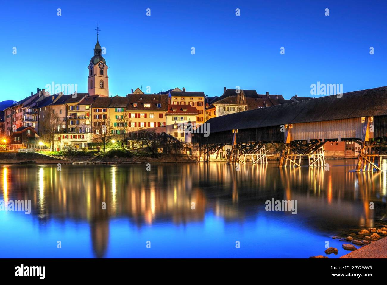 Nightscape of the old town of Olten with the famous wood covered bridge over the Aare river. Olten is a town in Solothurn Canton, Switzerland. Stock Photo