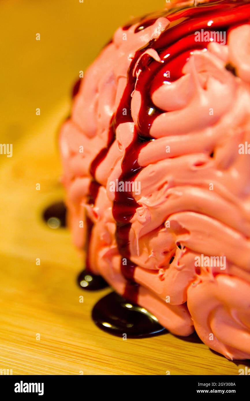 Realistic Halloween brain cake with red blood sauce Stock Photo