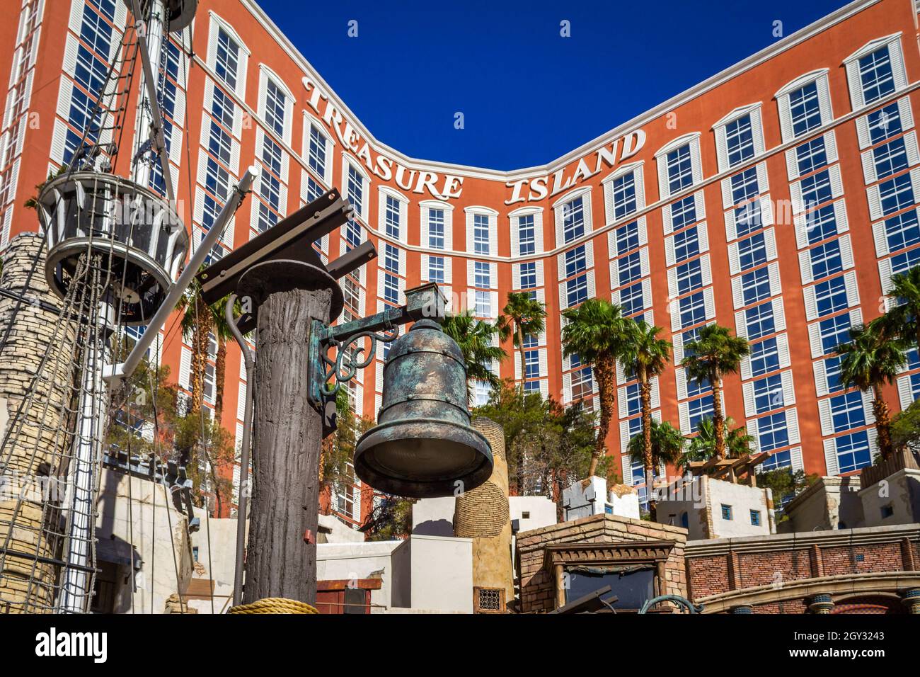 Las Vegas, NV, USA – June 8, 2021: Antique bell at the Pirate’s dock in front of Treasure Island Hotel and Casino located in Las Vegas, Nevada. Stock Photo