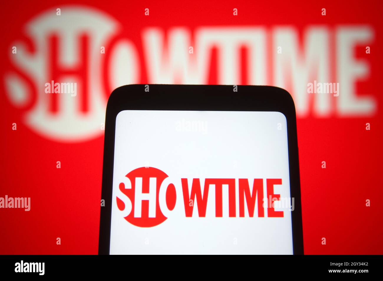 In this photo illustration, Showtime of a US television network is seen on a smartphone and a pc screen. Stock Photo