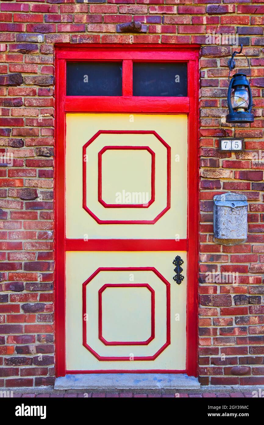 Colorful red door on red brick Stock Photo