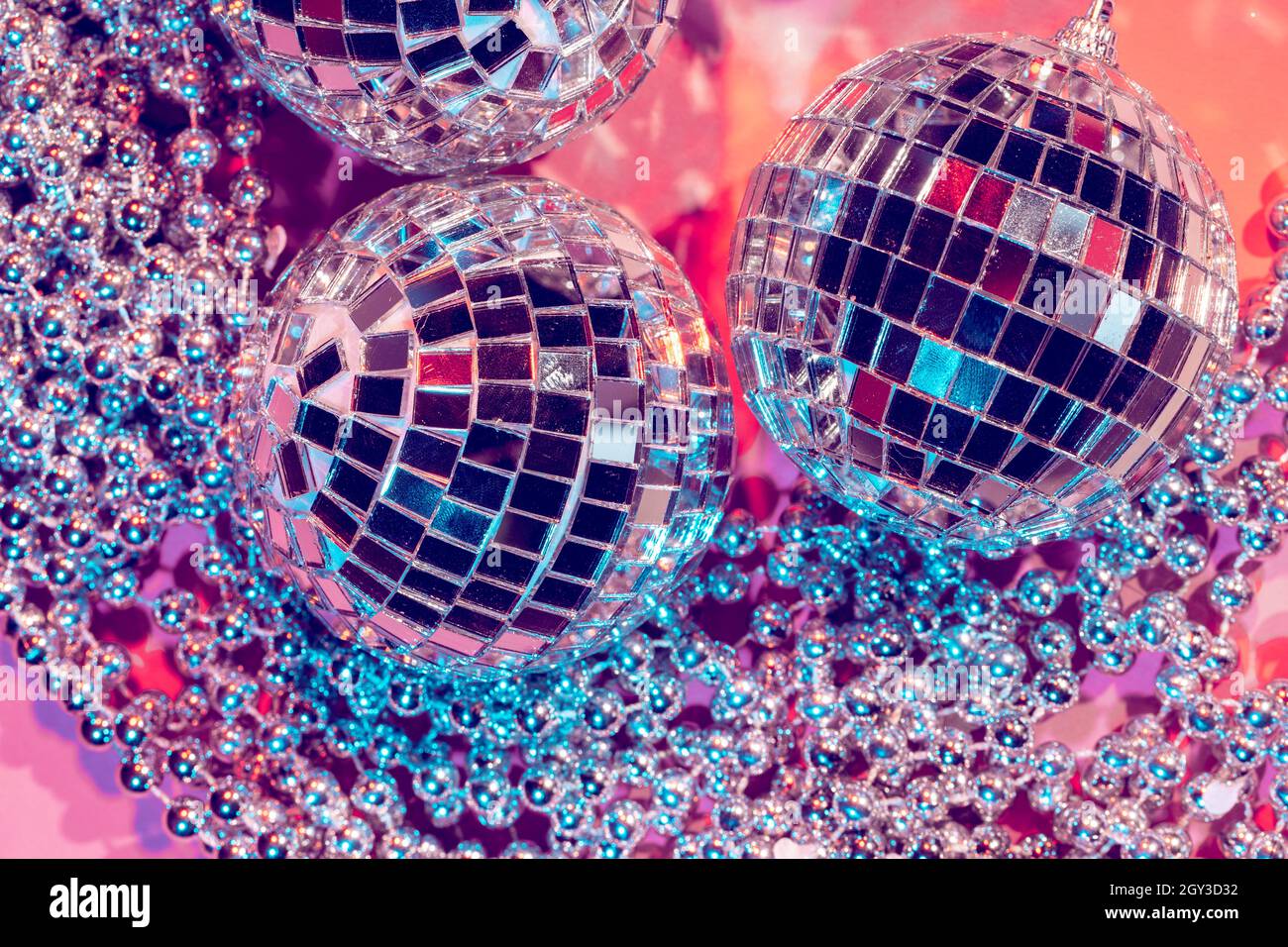 disco ball bauble pink background. party concept Photo - Alamy