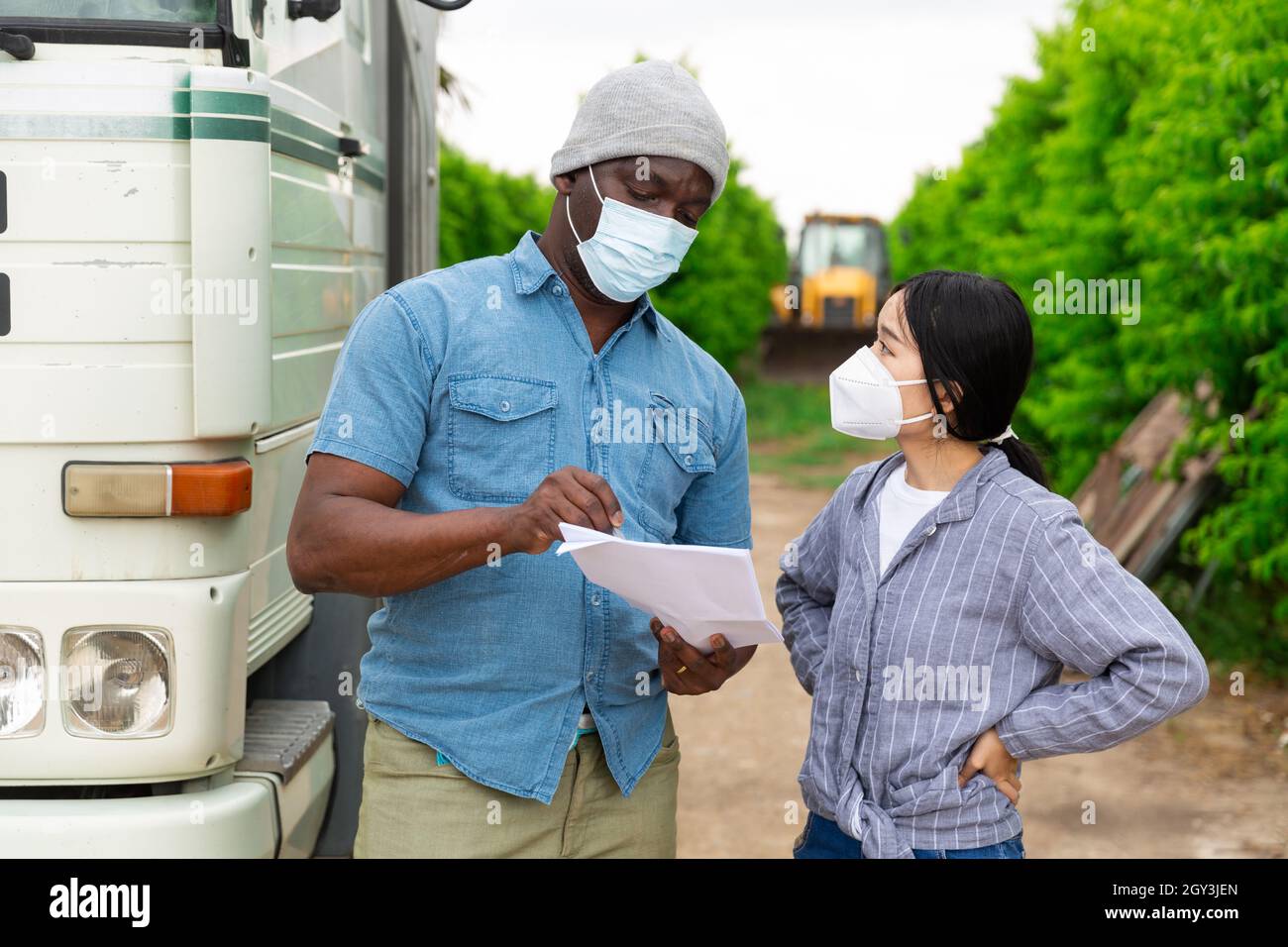 People near truck with mask Stock Photo