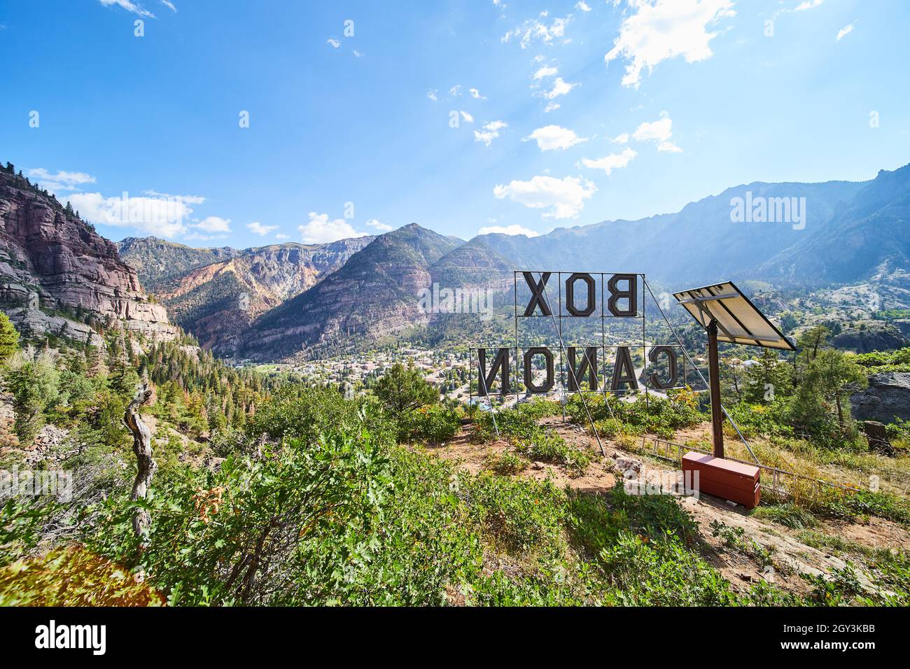 Top of mountain behind Box Canon sign with solar panel overlooking