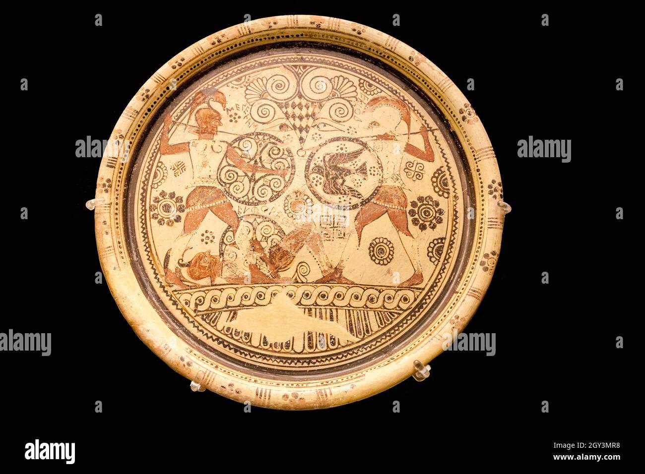Pottery plate about 600bc from Rhodes. Plate showing Menelaoas and Hektor fighting over the body of Euphorbos. Stock Photo